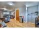 Finished basement area with cabinets, a mini fridge, and an entertainment area at 10342 Monterey Cir, Northglenn, CO 80260