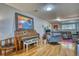 Finished basement area with wood floors and space for entertainment, music, and comfortable seating at 10342 Monterey Cir, Northglenn, CO 80260