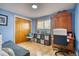 Bedroom with wood floors, a desk, and storage at 10342 Monterey Cir, Northglenn, CO 80260