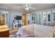 Bedroom with a TV, mirrored closet doors, and comfortable furnishings at 10342 Monterey Cir, Northglenn, CO 80260