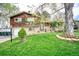 Beautiful home with lush green lawn, mature trees, and well-maintained exterior at 10342 Monterey Cir, Northglenn, CO 80260