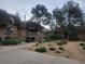 Exterior view of brick apartment buildings with individual decks in a landscaped community at 2190 S Holly St # 213, Denver, CO 80222