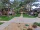 A condo community with mature trees, green lawns, and private decks off of each unit at 2190 S Holly St # 213, Denver, CO 80222