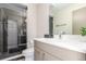 Modern bathroom featuring sleek vanity, contemporary fixtures, and a glass-enclosed shower at 1318 Yates St, Denver, CO 80204