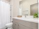 Bright bathroom featuring a modern vanity, stylish fixtures, and a shower/tub combination at 1318 Yates St, Denver, CO 80204