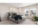 Bright bedroom with a large bed, two windows, and modern decor at 1318 Yates St, Denver, CO 80204