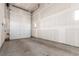 Spacious garage with a white door and ample room for parking and storage at 1318 Yates St, Denver, CO 80204