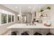 Modern kitchen with stainless steel appliances, quartz countertops, and large windows at 1318 Yates St, Denver, CO 80204