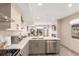 Open concept kitchen with eat-in island and stainless steel appliances at 1318 Yates St, Denver, CO 80204