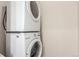 Efficient laundry area featuring a stacked washer and dryer set at 1318 Yates St, Denver, CO 80204