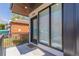 An inviting front porch with ample natural light and an outdoor welcome mat at 1318 Yates St, Denver, CO 80204