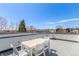 This is a spacious rooftop deck for entertaining and enjoying the skyline at 1318 Yates St, Denver, CO 80204