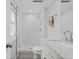 Bright bathroom featuring a glass-enclosed shower, marble countertop, and modern fixtures at 3966 S Magnolia Way, Denver, CO 80237
