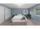 Bedroom featuring a queen bed, double closet doors and a sitting bench at 3966 S Magnolia Way, Denver, CO 80237