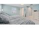 Bedroom featuring a comfortable bed, ample natural light, and a mirror at 3966 S Magnolia Way, Denver, CO 80237