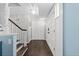 Entryway features a long hallway with hardwood floors and white doors, offering ample storage space at 3966 S Magnolia Way, Denver, CO 80237