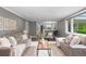 Comfortable living room with neutral decor, hardwood floors, and an open layout to the kitchen at 3966 S Magnolia Way, Denver, CO 80237