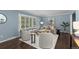 Bright living room featuring stylish furniture, bay window, hardwood floors and contemporary decor at 3966 S Magnolia Way, Denver, CO 80237