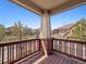 Balcony view of a quiet street featuring well-maintained homes and blue skies at 10162 Bluffmont Ln, Lone Tree, CO 80124
