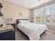 Bright and airy bedroom with a large window and neutral décor at 10162 Bluffmont Ln, Lone Tree, CO 80124