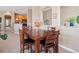 Charming dining area featuring a wooden table, leather chairs, and natural light at 10162 Bluffmont Ln, Lone Tree, CO 80124