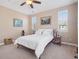 Bright bedroom with windows and ceiling fan offering natural light and comfort at 10162 Bluffmont Ln, Lone Tree, CO 80124