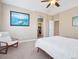 Well-lit bedroom featuring a cozy chair and doorway to a walk-in closet at 10162 Bluffmont Ln, Lone Tree, CO 80124