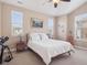 Cozy bedroom filled with natural light from the windows and a comfortable ambiance at 10162 Bluffmont Ln, Lone Tree, CO 80124