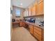 Home office with wood cabinets, work surfaces, and carpet flooring at 10162 Bluffmont Ln, Lone Tree, CO 80124