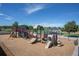 Community playground offering various climbing structures, slides, and a cushioned ground cover at 10162 Bluffmont Ln, Lone Tree, CO 80124