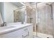 Modern bathroom with a double sink vanity and a glass-enclosed shower at 852 Kalamath St, Denver, CO 80204