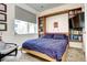 Cozy bedroom with a Murphy bed and built-in bookshelves for stylish storage at 852 Kalamath St, Denver, CO 80204