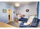 Charming bedroom with cozy furniture, a decorative chandelier, and ample natural light at 852 Kalamath St, Denver, CO 80204
