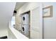 A convenient, stacked washer and dryer unit is neatly tucked away behind louvered doors at 852 Kalamath St, Denver, CO 80204