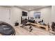 Spacious basement featuring workout equipment and a mounted TV at 6211 Stable View St, Castle Pines, CO 80108