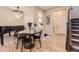 Dining room with chandelier and piano at 6211 Stable View St, Castle Pines, CO 80108