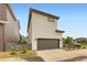 Charming two-story home with a two car garage, modern fence, and landscaping at 6211 Stable View St, Castle Pines, CO 80108