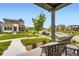 Inviting front porch offers seating with a view of the neighborhood at 6211 Stable View St, Castle Pines, CO 80108