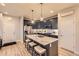 Modern kitchen featuring stainless steel appliances, a center island, and stylish pendant lighting at 6211 Stable View St, Castle Pines, CO 80108