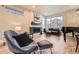 Spacious living room featuring a sleek fireplace, large windows, and stylish decor at 6211 Stable View St, Castle Pines, CO 80108