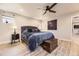 Main bedroom with ceiling fan and wood-look floors, decorated with butterfly decals at 6211 Stable View St, Castle Pines, CO 80108