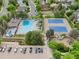 Aerial view showcasing community pool, tennis courts and play area at 17051 Wellington Dr, Parker, CO 80134