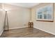 Cozy bedroom with hardwood flooring, bright natural light, and simple design elements at 17051 Wellington Dr, Parker, CO 80134