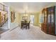 Bright dining area featuring elegant furniture, open staircase, and seamless flow to other spaces at 17051 Wellington Dr, Parker, CO 80134