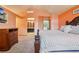 Spacious main bedroom featuring vaulted ceilings, a luxurious bed, and an ensuite bathroom at 17051 Wellington Dr, Parker, CO 80134