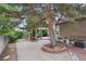 The outdoor patio area boasts tile flooring, mature landscaping, a grill, and space for outdoor dining at 17051 Wellington Dr, Parker, CO 80134