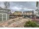 Charming backyard with stone pathway, pergola, and outdoor seating area for relaxation at 1793 E 164Th Pl, Brighton, CO 80602