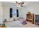 Bright bedroom with plush carpet, ceiling fan and playful decor at 1793 E 164Th Pl, Brighton, CO 80602