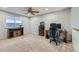 Versatile bonus room with plush carpet, ceiling fan and a window with natural light at 1793 E 164Th Pl, Brighton, CO 80602