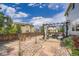 Landscaped backyard featuring a stone pathway, a patio with seating, and a pergola at 1793 E 164Th Pl, Thornton, CO 80602
